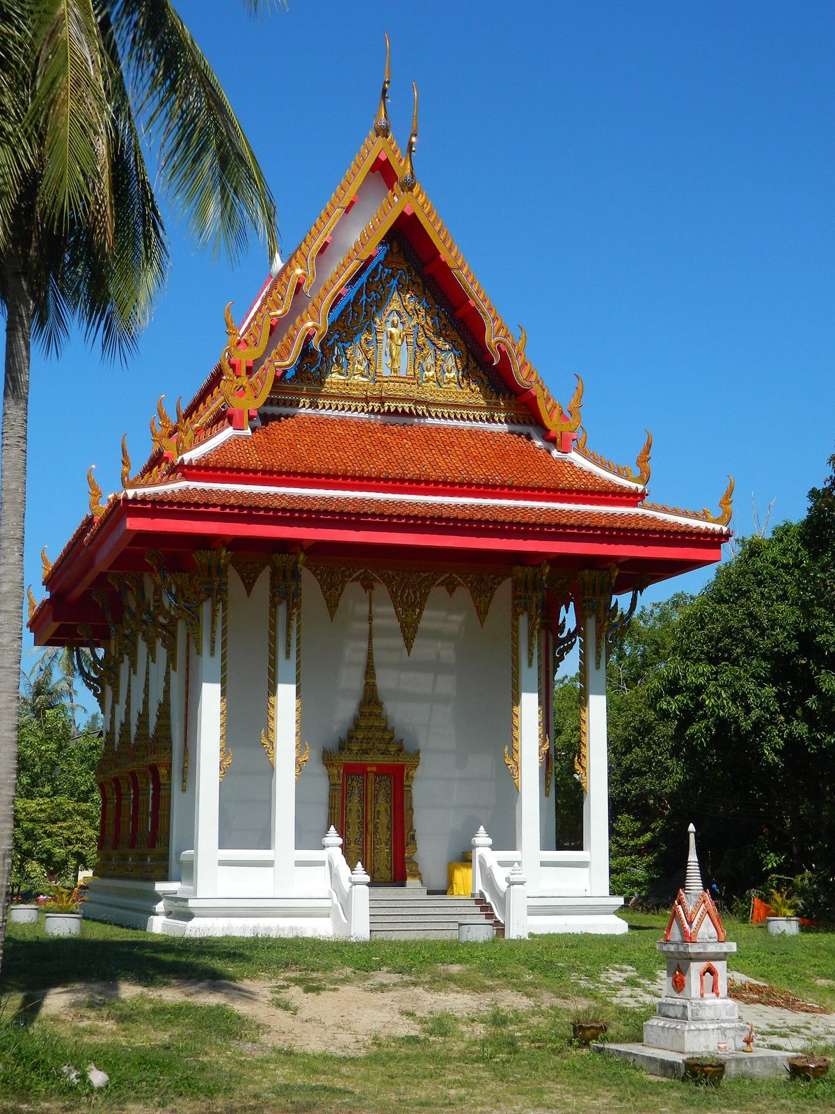 Red and gold roof of the ordination hall at Wat Si Thanu temple, Srithanu, Koh Phangan
