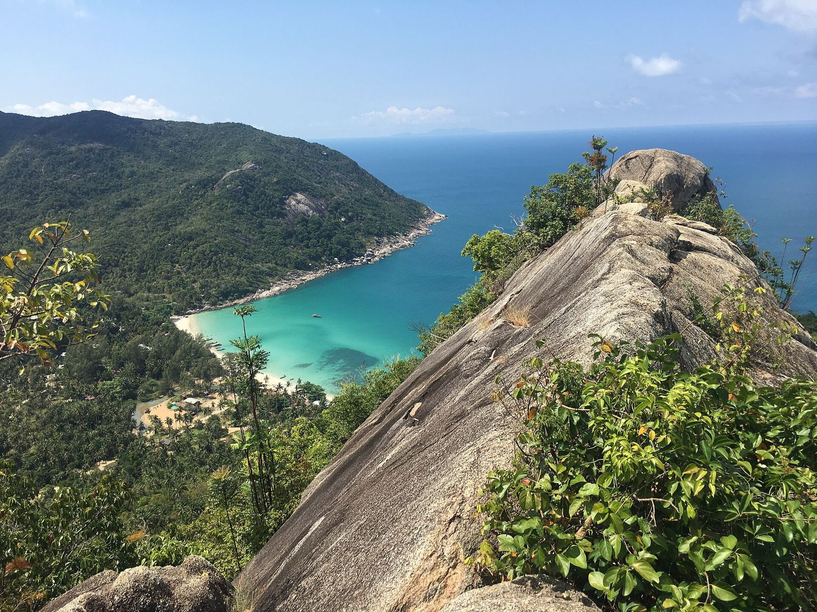 View from a granite ridge down to the turquoise bay of Bottle Beach, Koh Phangan